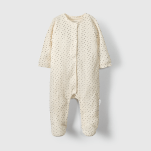 Enterito beige suave para guagua con puntos de diseño tierno