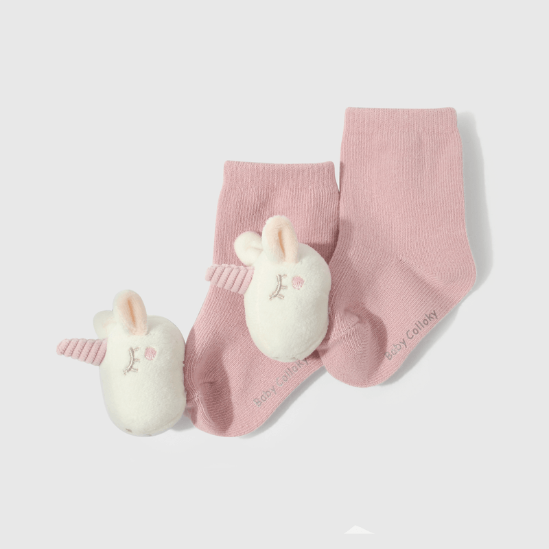 Calcetines rosados con unicornio para guaguas adorables