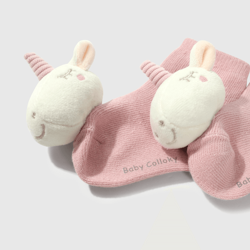 Calcetines rosados con unicornio para guaguas adorables