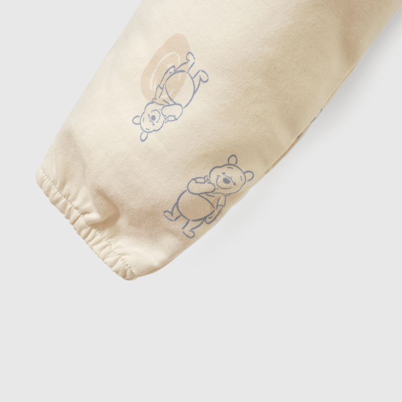 Buzo beige con Winnie the Pooh para guaguas
