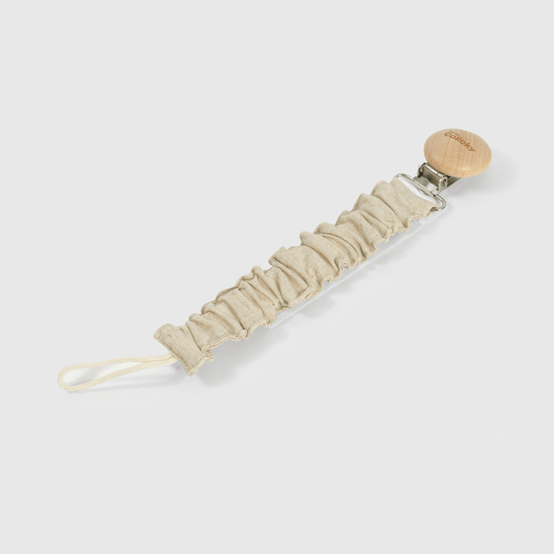 Portachupete beige para guaguas, accesorio tierno y práctico