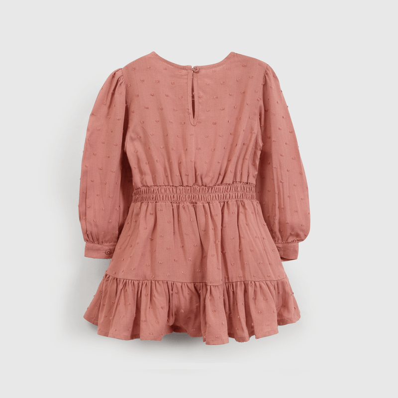 Vestido encantador para niña en suave tono rosado