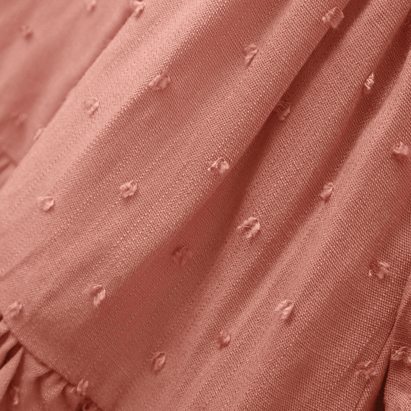 Vestido encantador para niña en suave tono rosado