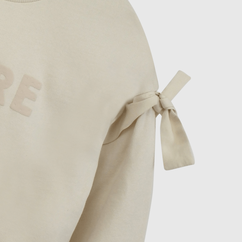 Polerón Beige Nudos  de Niña talla 3 a 12 añoss